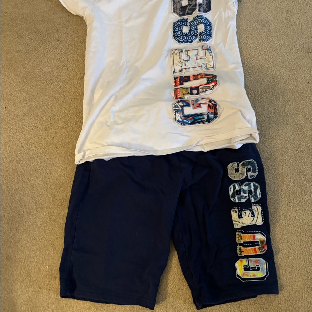 Guess White Cotton T-Shirt and blue shorts
